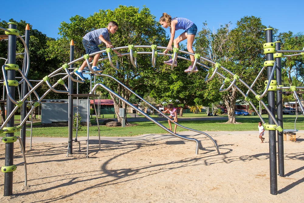 Child playing on an arch at Shang Street Park