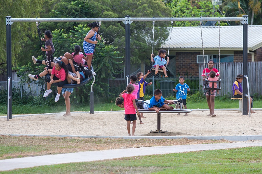 Child playing on a swing at Shang Street Park