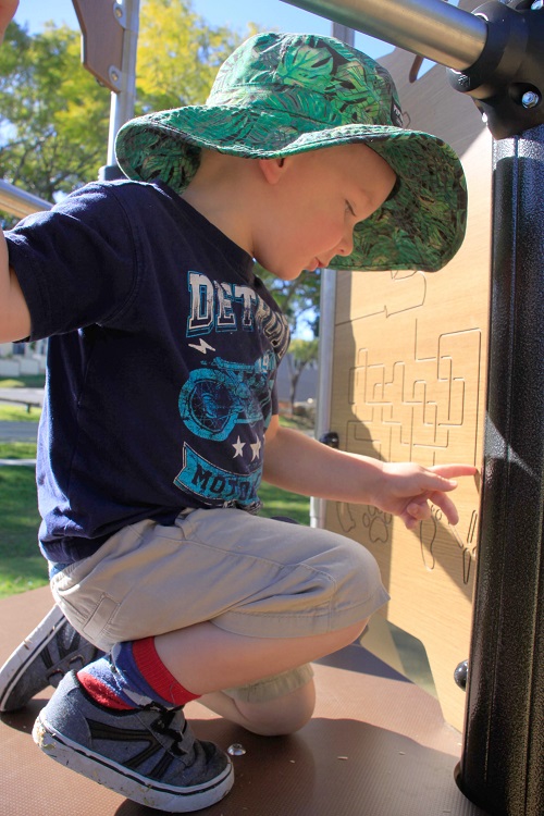 Child playing at Joe Foster Park playground