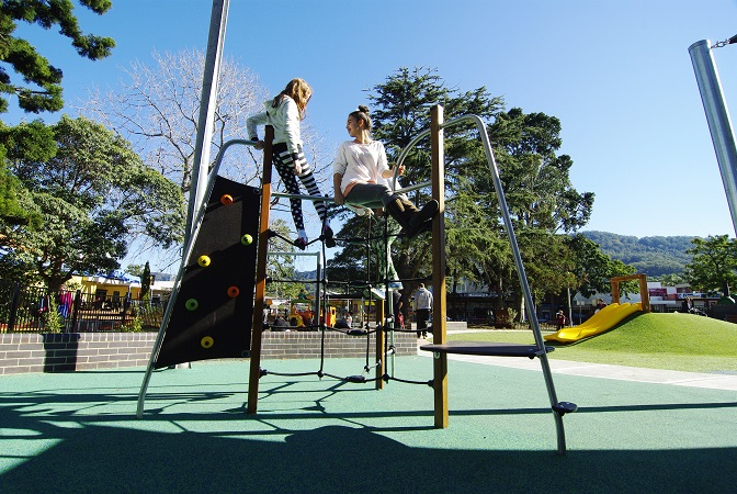 Child playing at Luke's place playground