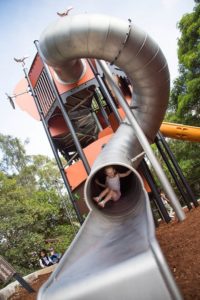 Child playing on a slide at Tower Giant Tube Slide