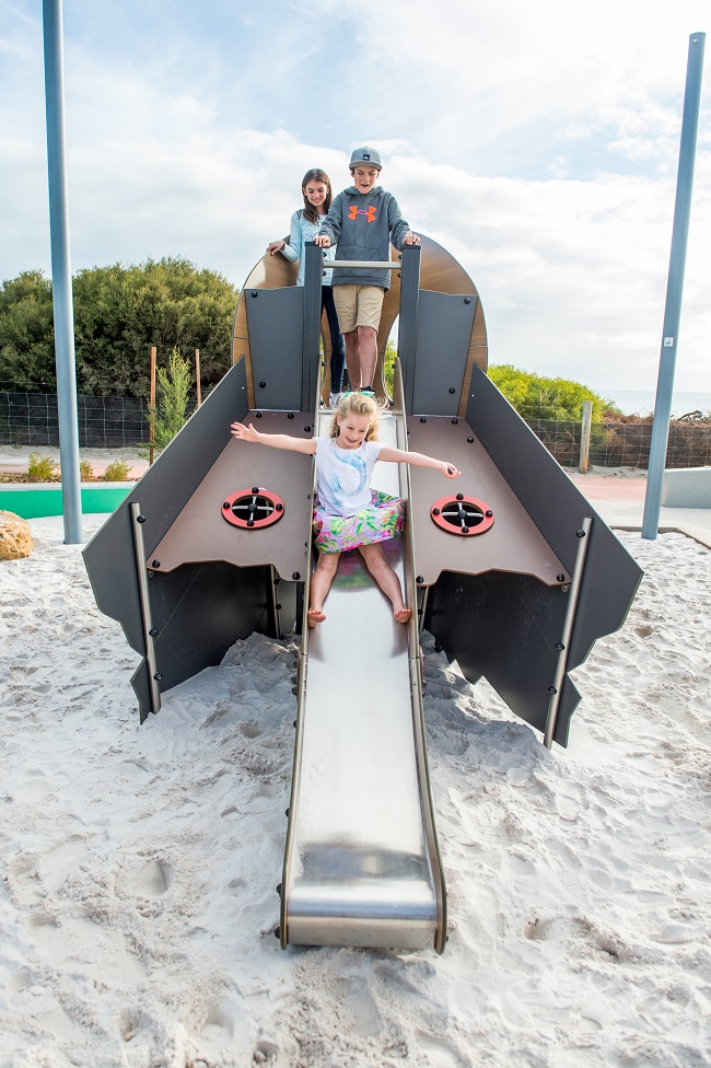 Child playing on a slide at North Coogee SS Wyola Tug Boat Playground