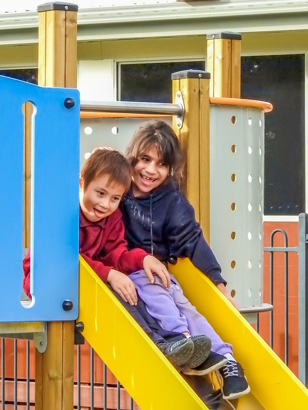 Child playing on a slide at East Gippsland Specialist School Playground