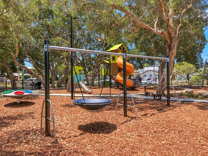 Swing set at Lions Park Yamba Adventure Playground