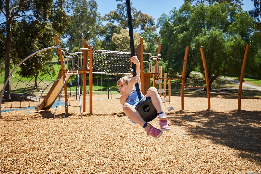 Child playing on a cableway at Austin Crescent Reserve playspace
