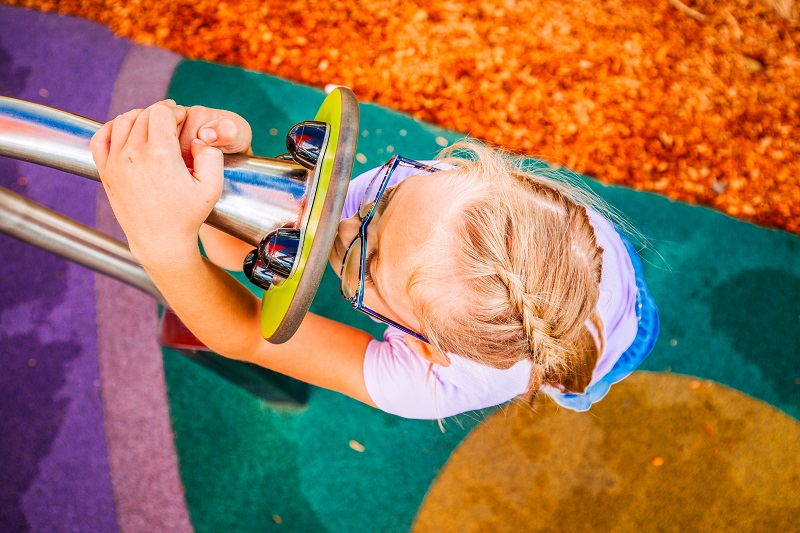 child playing at Wolseley Park Inclusive Playground
