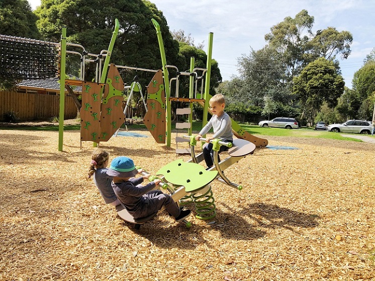 Child playing on a springer at Naughton Patch Playspace