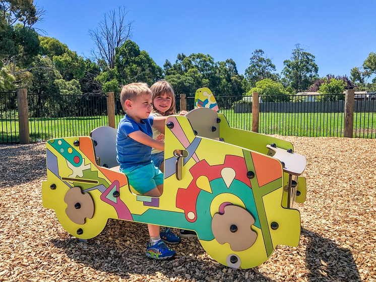 Child playing on a car springer at Eric Taylor Reserve Playground