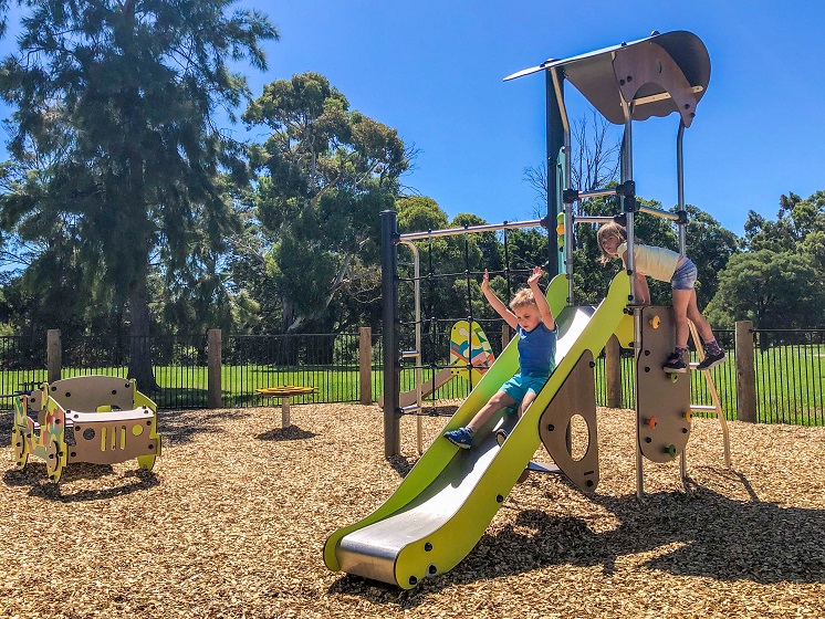 Child playing on a slide at Eric Taylor Reserve Playground