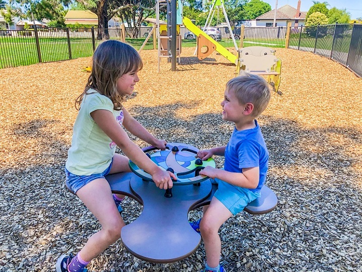 Child playing on a star springer at Eric Taylor Reserve Playground