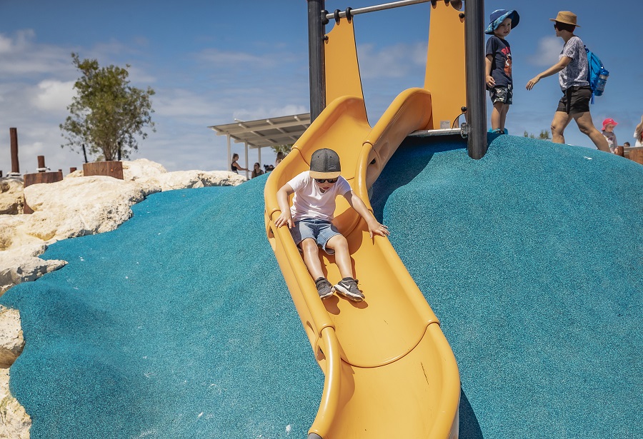 Child playing on a slide at Amberton Beach Lighthouse Park