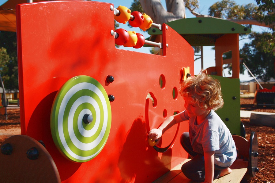 Child playing at Byford on the Scarp Playground