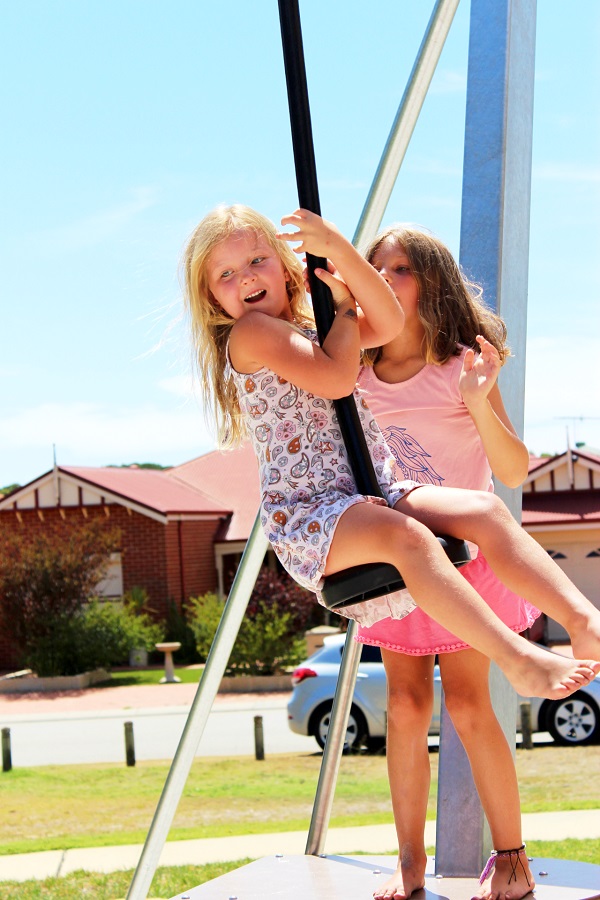 Child playing on a cableway at Covent Park Pearsall Playground