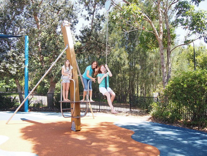 Child playing on a cableway at Flying Fox Park