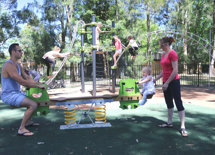 child playing on a springer at Frank Beckman Playground