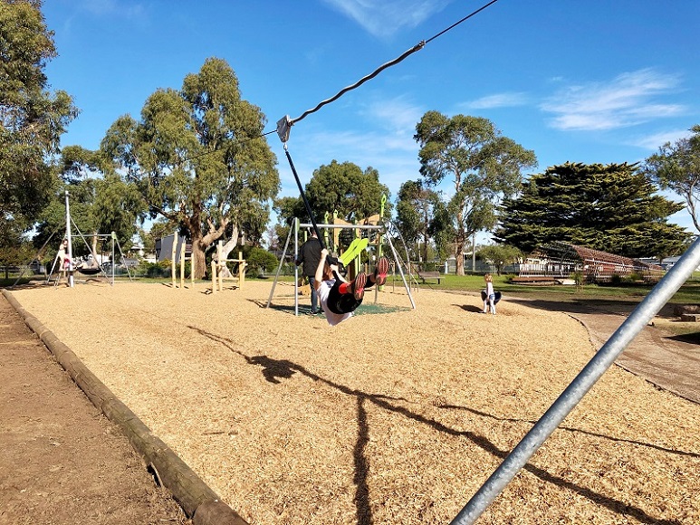 Child playing on a cableway at Harold Hughes Reserve Playground