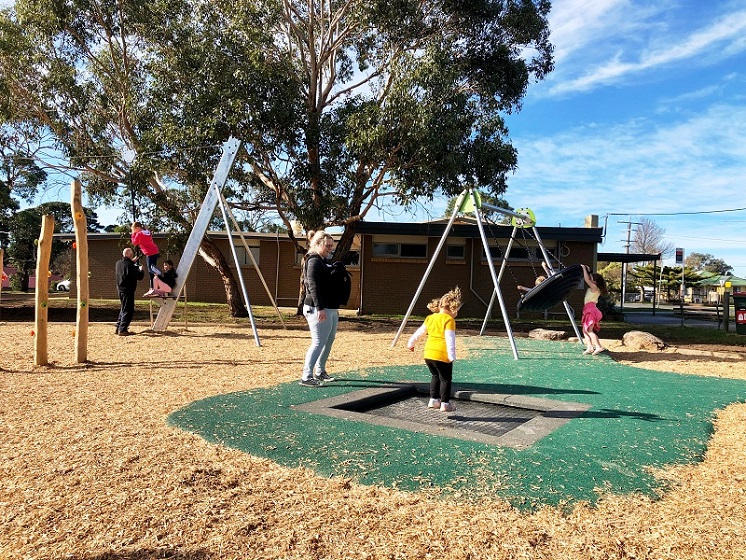 Child playing on a trampoline at Harold Hughes Reserve Playground