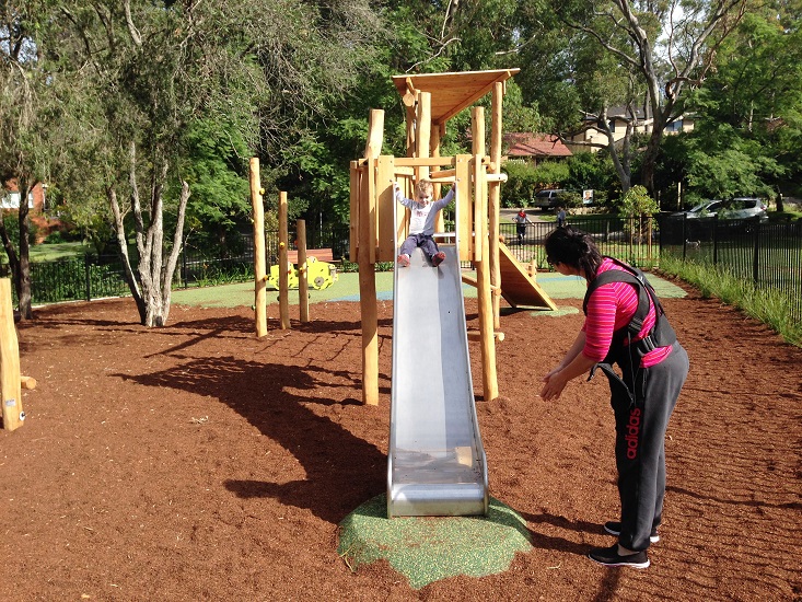 Child playing on a slide at Lyne Road Reserve Playground