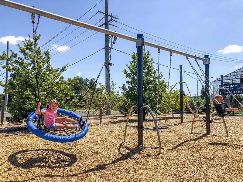 Child playing on a swing at Officer Recreation Reserve