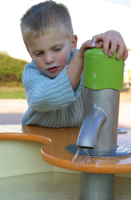 Child playing with water at Port Phillip Specialist School Sensory Play Space