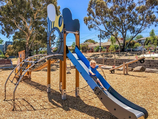 Child playing on a slide at Sheils Reserve Themed Playground