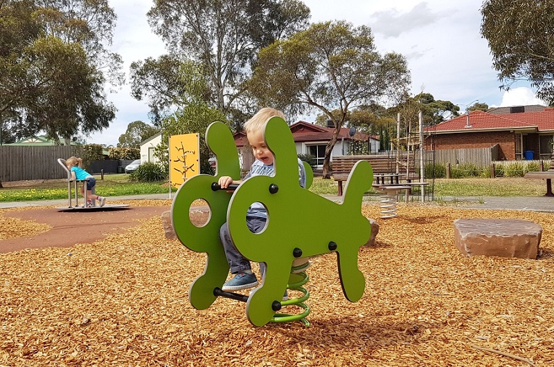 Child playing on a springer at Tranter Square Reserve Playground