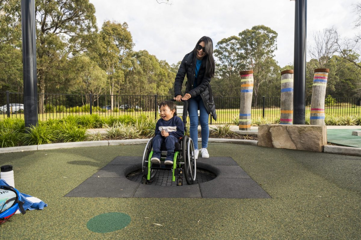 Boy in wheelchair on trampoline