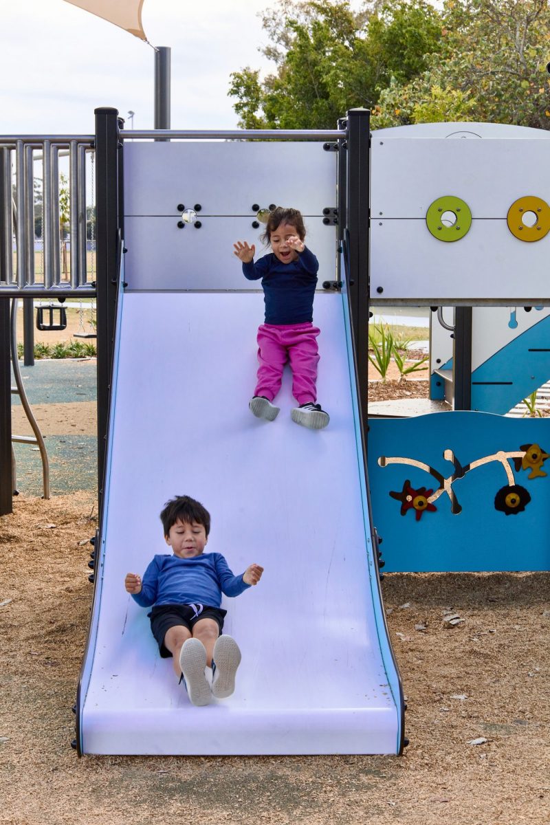 Children on a slide at Kitchener Park Playground