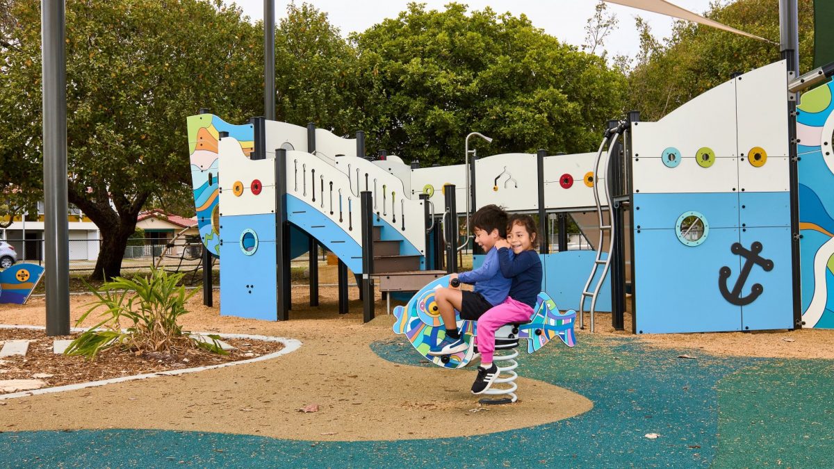 2 children on springer at a playground