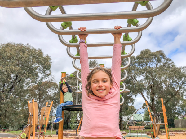 Kid hanging from Ixo play unit