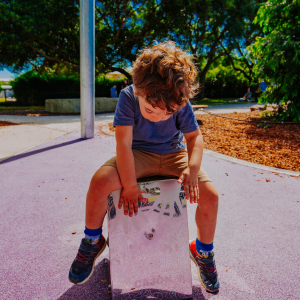 Child playing with musical instrument