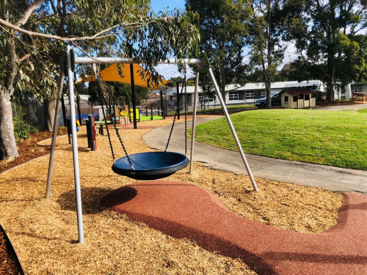 Inclusive Pod Swing and musical play in a school playground