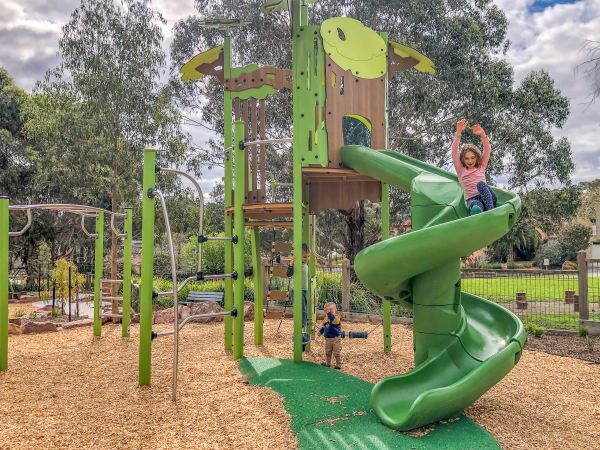 Children playing with Ka'Yop tower and swirly slide
