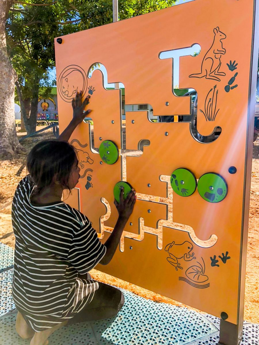 International Day of Play: Girl playing with a native animal panel