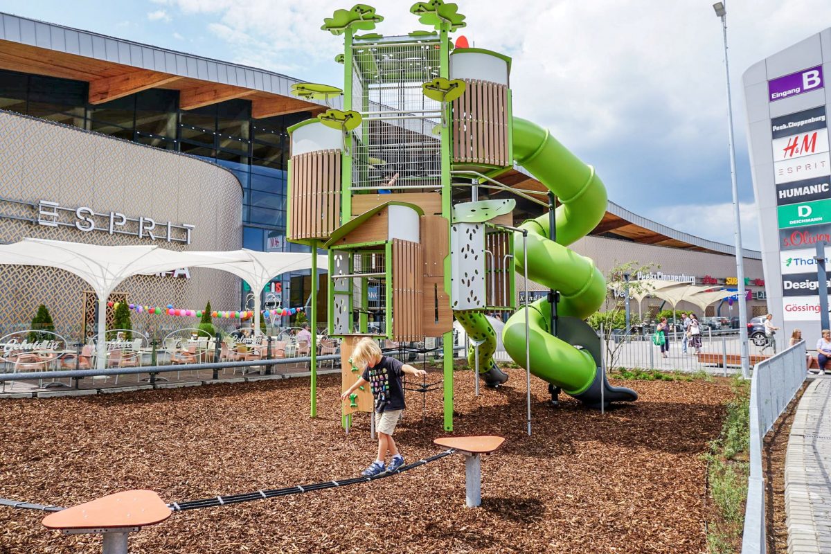 Outdoor shopping centre playground with slack line