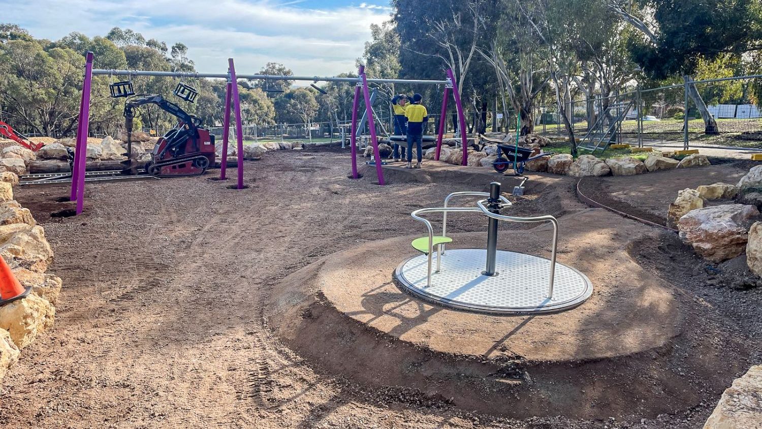 Professional installation team installing a playground